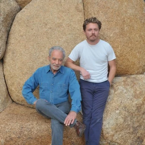 Rod Shapiro and Tristan Dolce standing in front of boulders